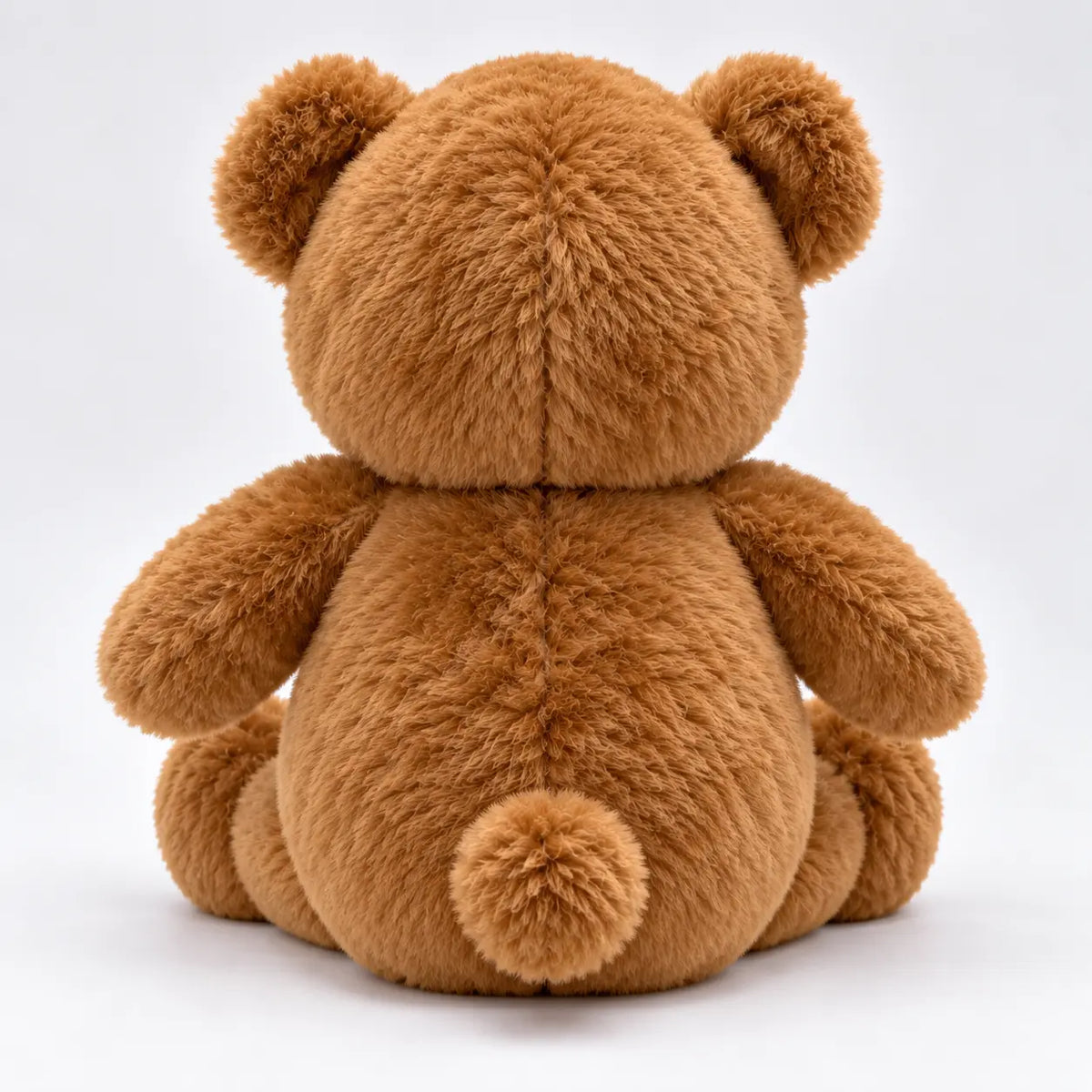 gold medal on brown teddy bear