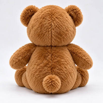 gold medal on brown teddy bear
